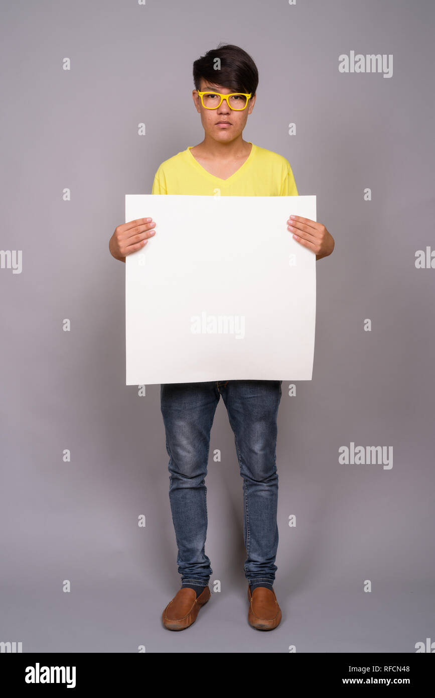 Teenage boy blank sign hi-res stock photography and images - Alamy