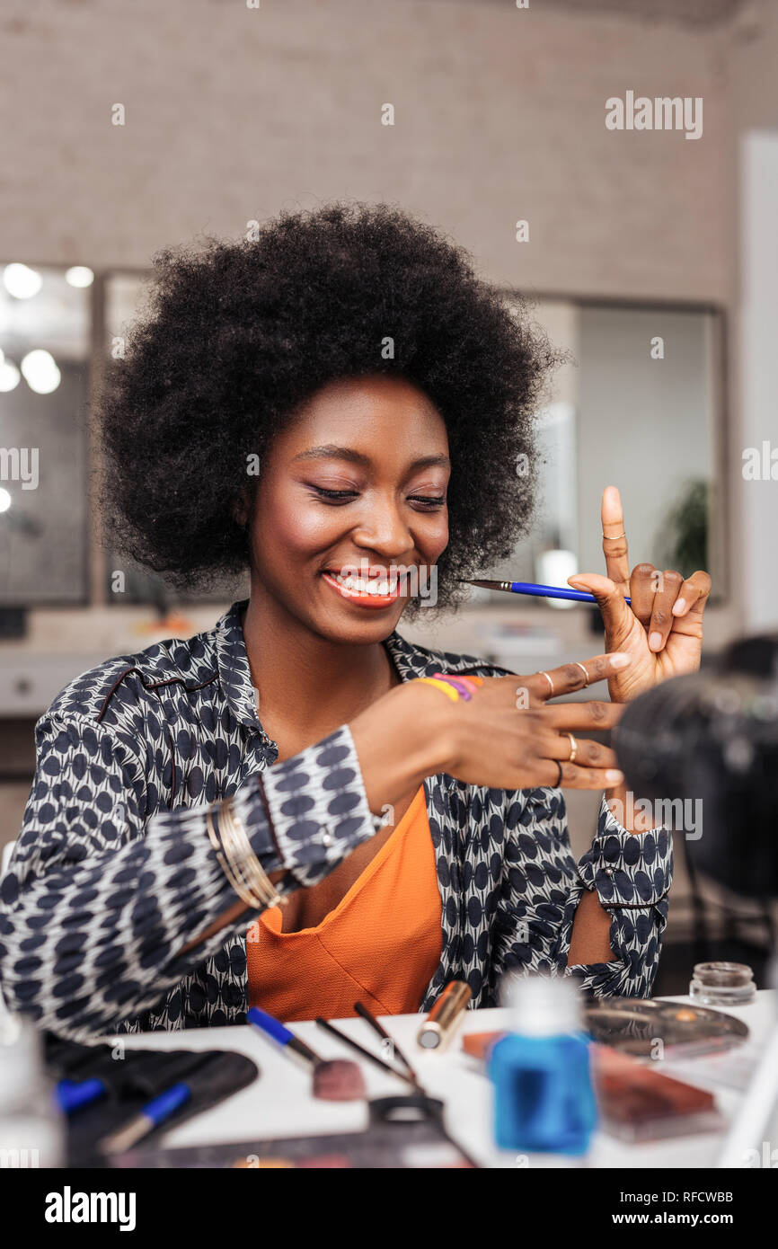 Beautiful dark-skinned african american woman feeling happy Stock Photo