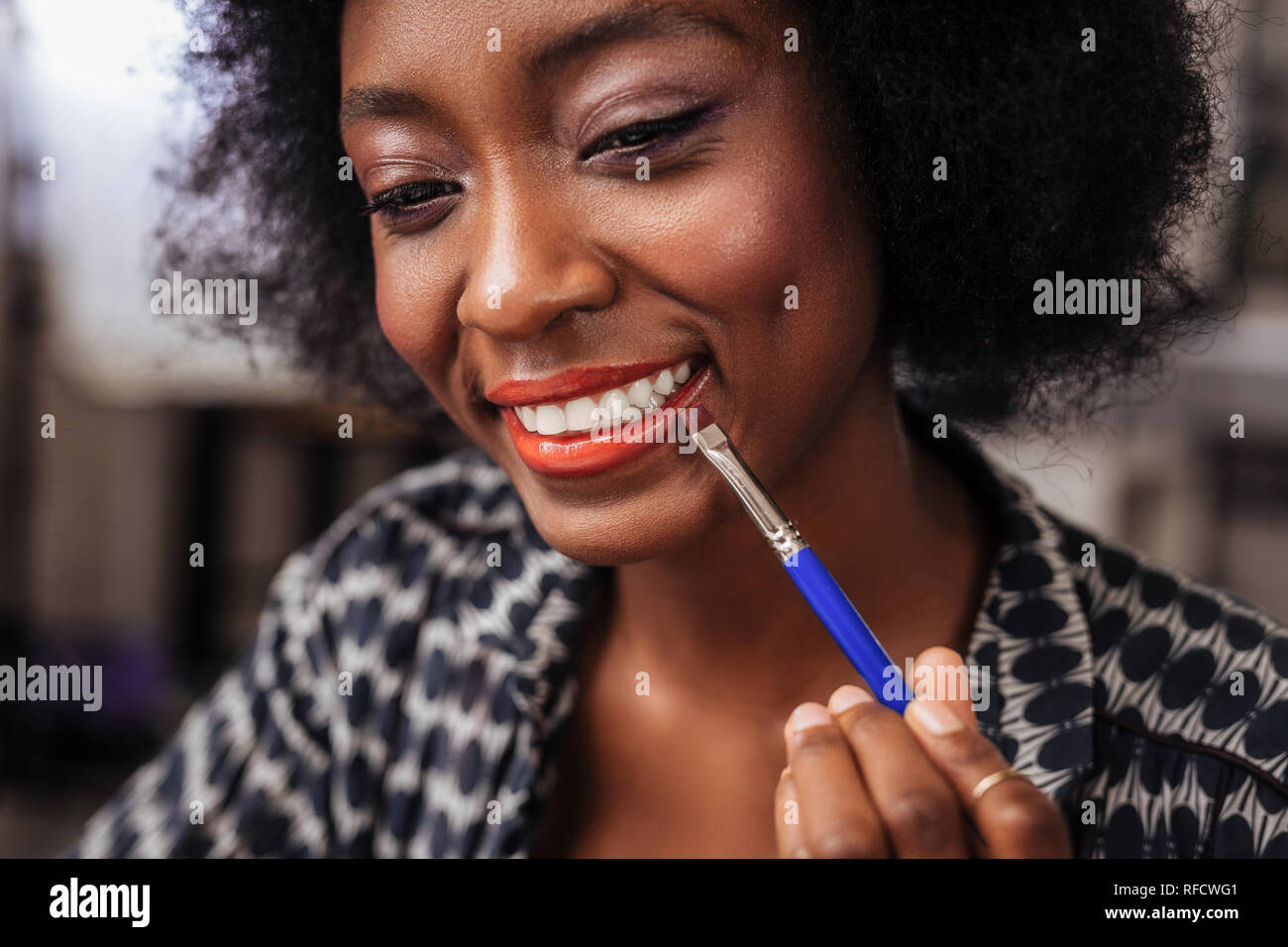 Amazing african american woman with curly hair smiling happily Stock ...
