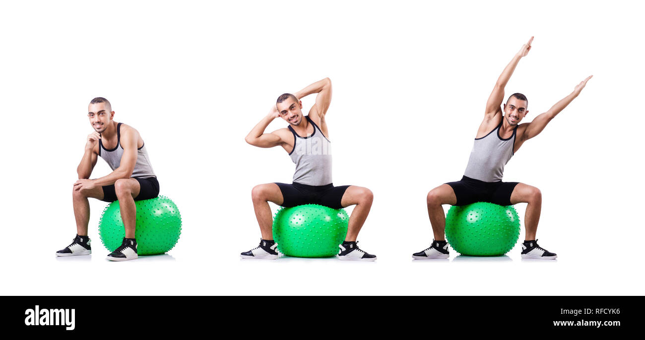 Man with swiss ball doing exercises on white Stock Photo - Alamy