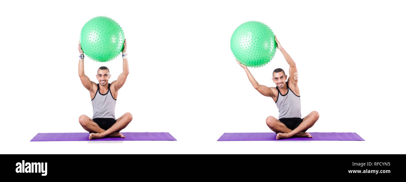 Man with swiss ball doing exercises on white Stock Photo - Alamy