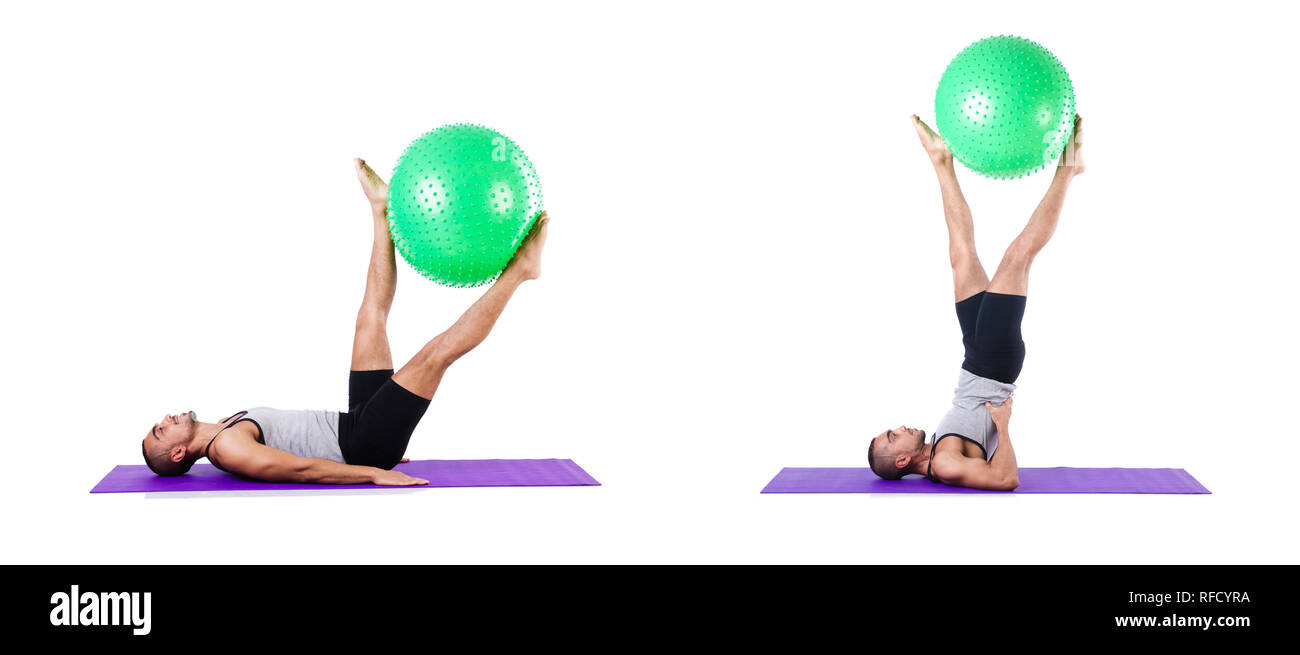 Man with swiss ball doing exercises on white Stock Photo - Alamy