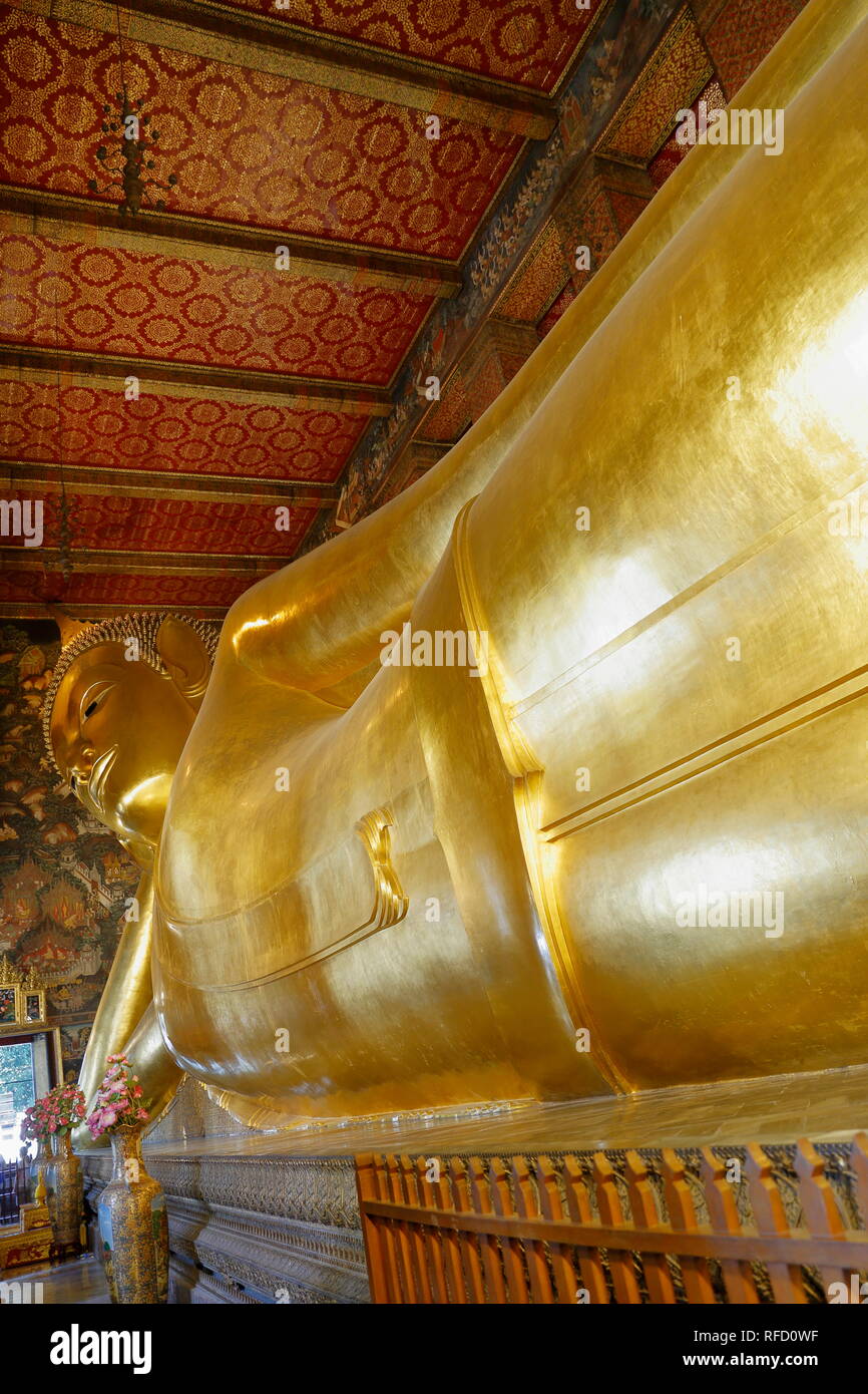 Wat Pho Buddhist Temple. Gold-plated Great Reclining Buddha statue. Bangkok, Thailand. Stock Photo