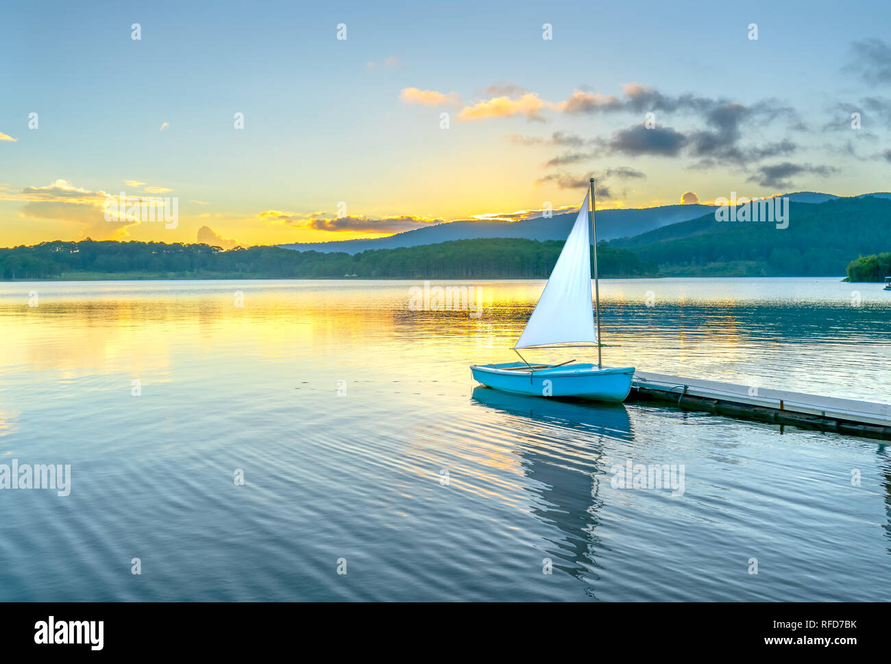 Lonely Sailboat In The Beautiful Sunset With Sun Stars Shines From Sky And The Surface Of The Lake Is Calm And Peaceful When Watching Them Stock Photo Alamy
