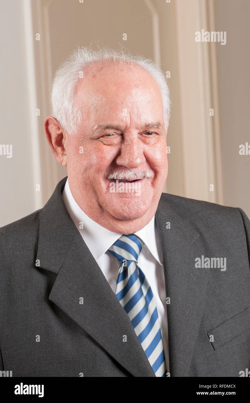 Happy old man looking away smiling Stock Photo