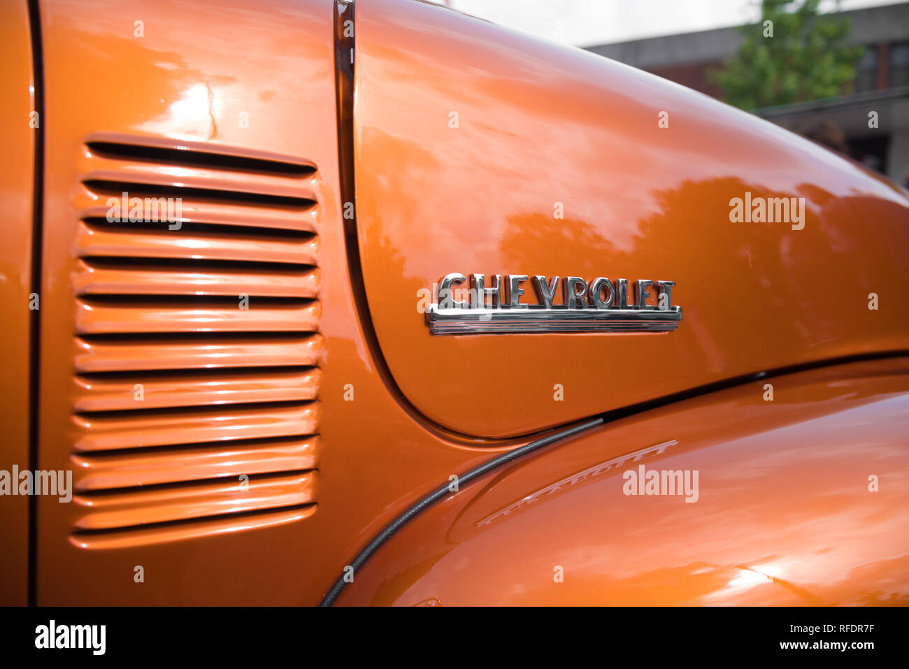 NIJVERDAL, NETHERLANDS - SEPTEMBER 17, 2017: Closeup of a chevrolet logo on an orange brown oldtimer car. Stock Photo