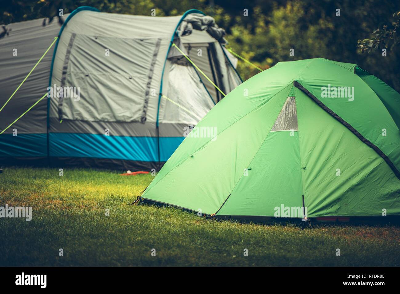 Summer Vacation Camping in a Tent. Campsite with Two Large Tents. Stock Photo