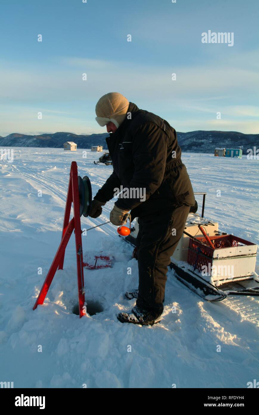 CAN Canada Lock cabins ice fishing on frozen Saguenay Fjord near city