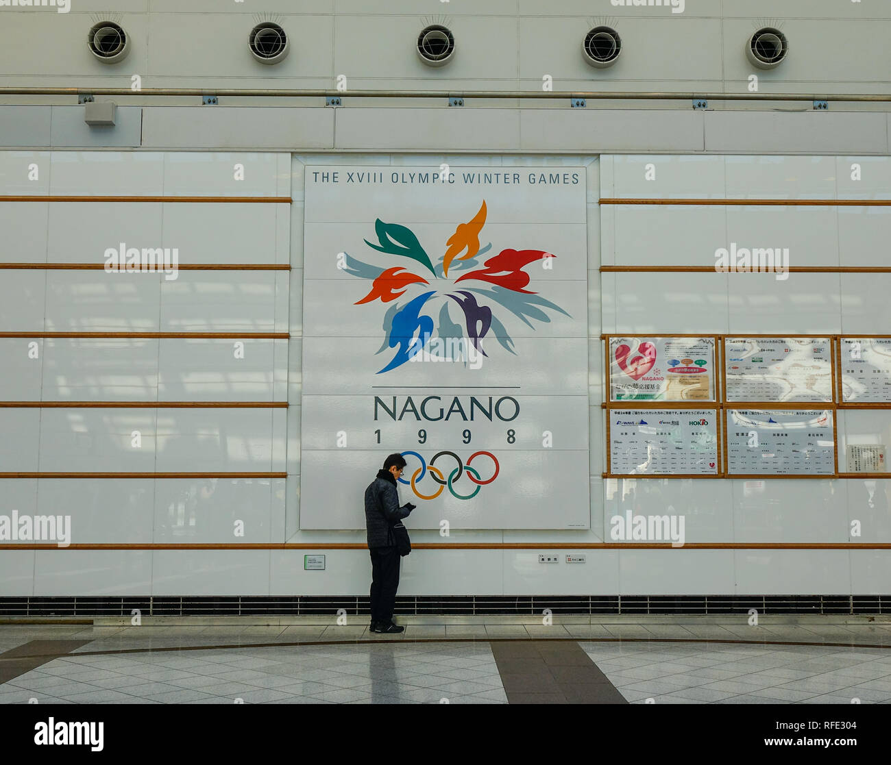 Nagano, Japan - Dec 30, 2015. Billboard of Olympic Winter Games XVIII 1998 at railway station in Nagano, Japan. Stock Photo