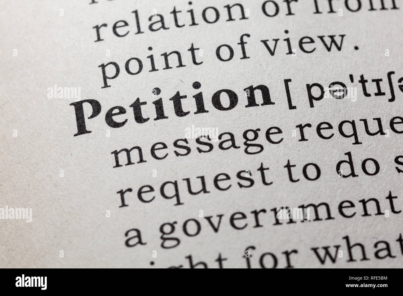 Fake Dictionary, Dictionary definition of the word petition. including key descriptive words. Stock Photo