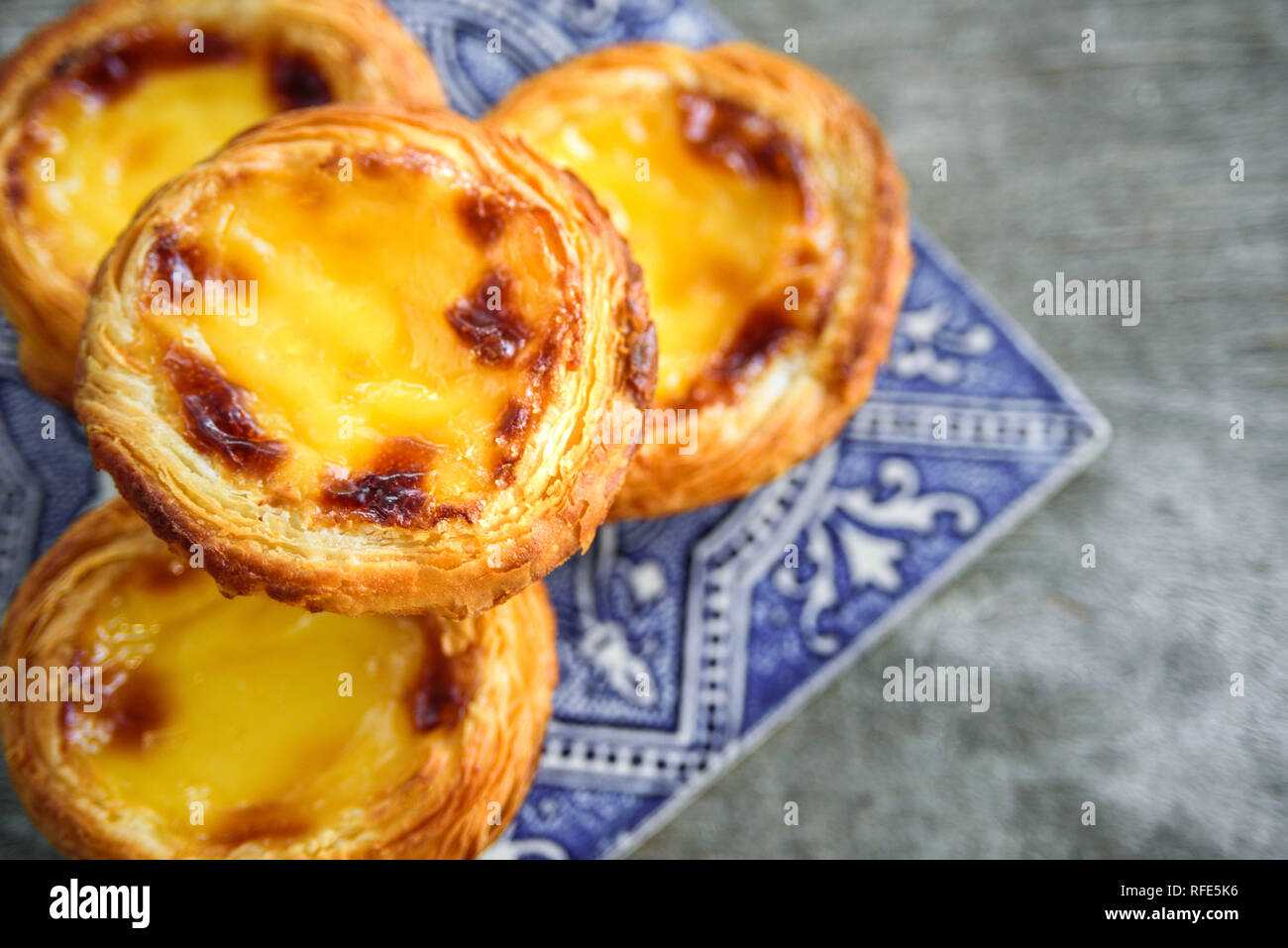 Portugal egg tart Pastel de Nata with azulejo tile Stock Photo