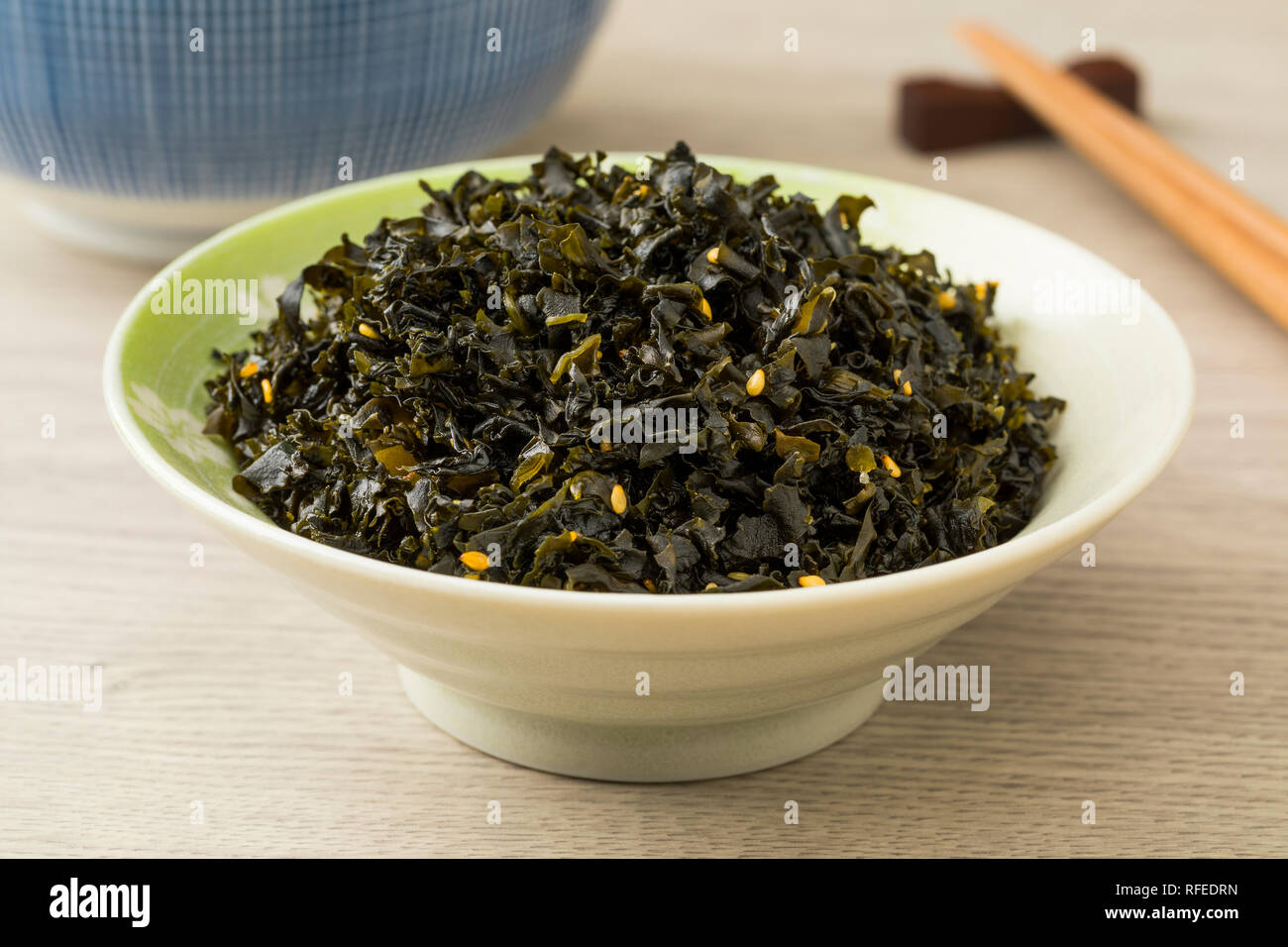 Bowl with Japanese seaweed with white sesame seed and plum, an instant