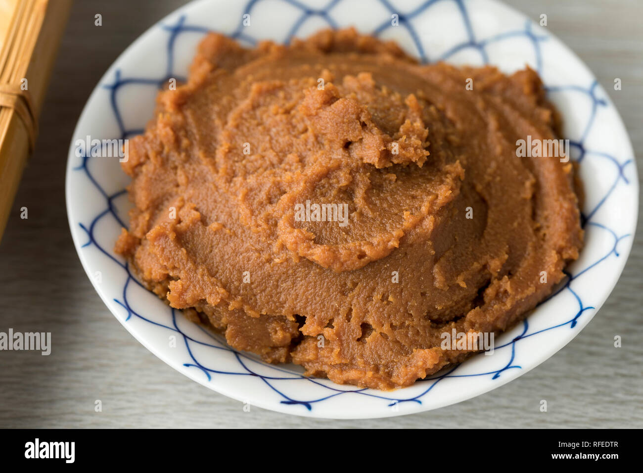Bowl with Japanese miso paste as an ingredient close up Stock Photo