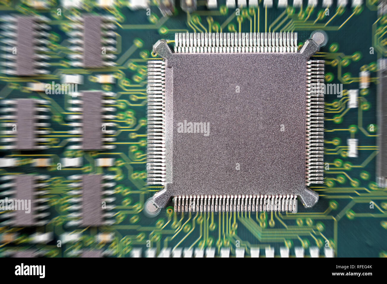PCB Printed Circuit Board with many electrical components Stock Photo