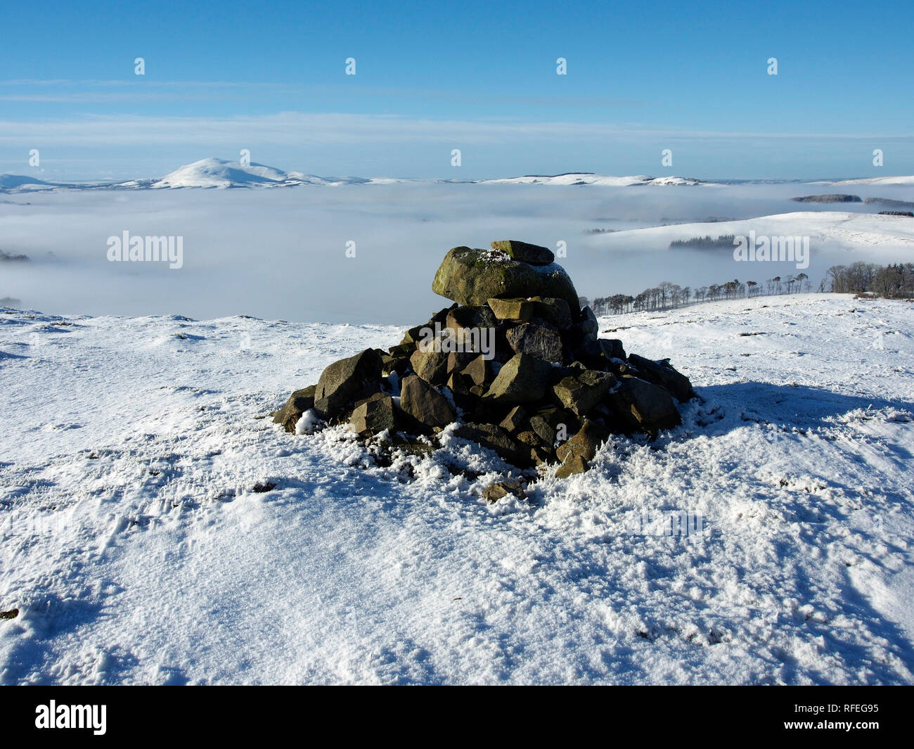 Snowy summit cairn, Langlaw hill, near Broughton, Southern Uplands, Scotland Stock Photo