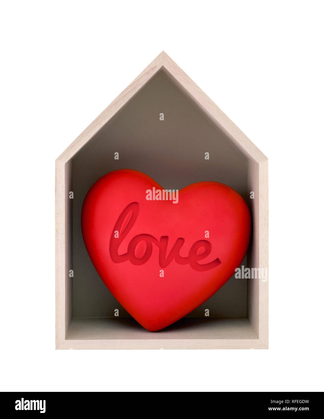 Wooden house and red heart with imprinted word love isolated on white with clipping path Stock Photo