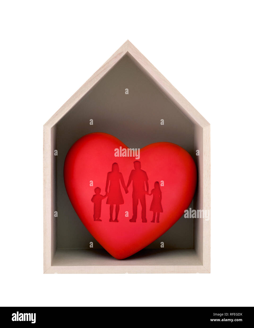 Wooden house and red heart with imprinted family shape isolated on white with clipping path Stock Photo