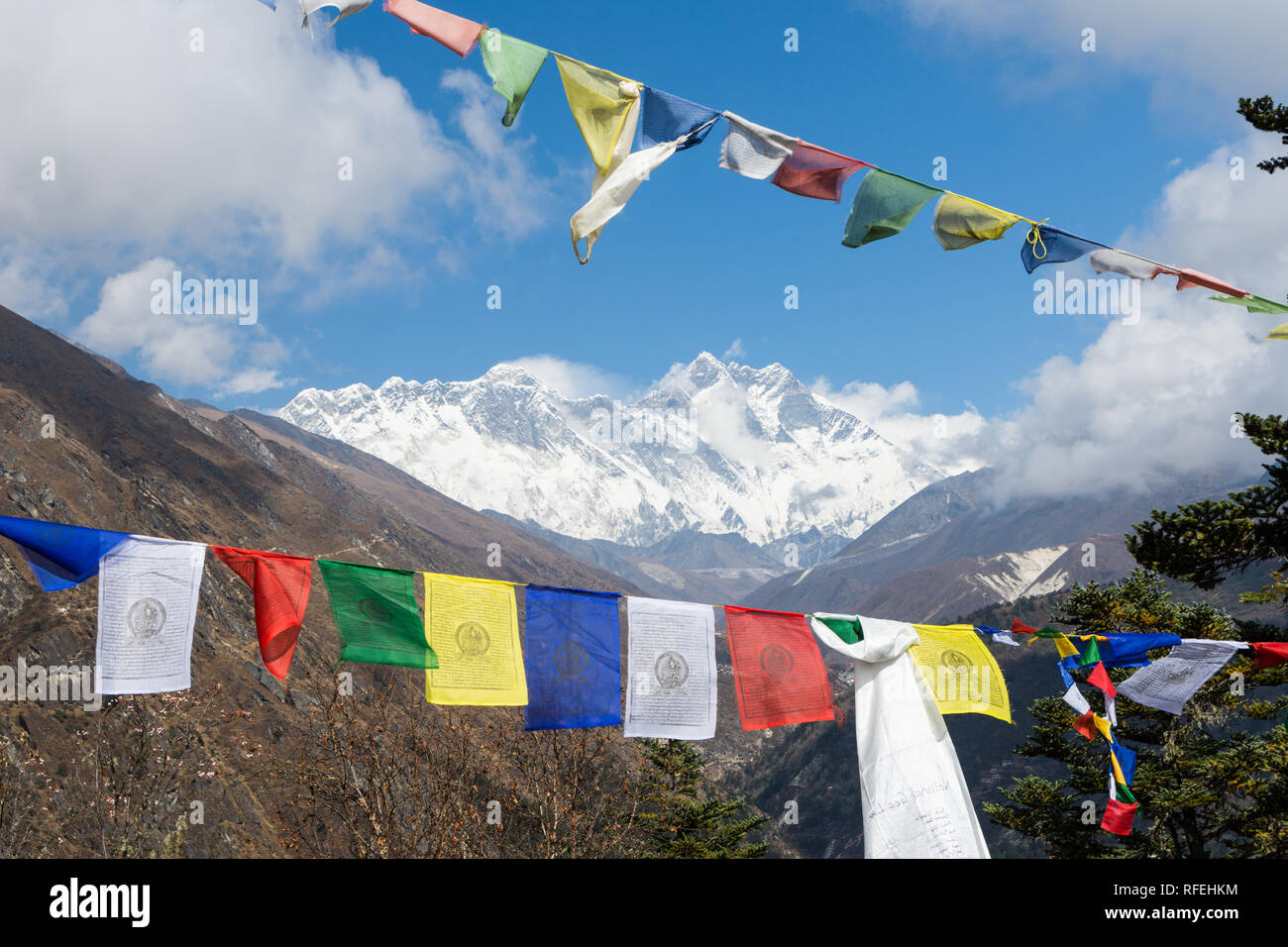 Mount Everest and Lhotse seen through Tibetan Buddhist prayer flags from Tengboche, Sagarmatha, Nepal Stock Photo