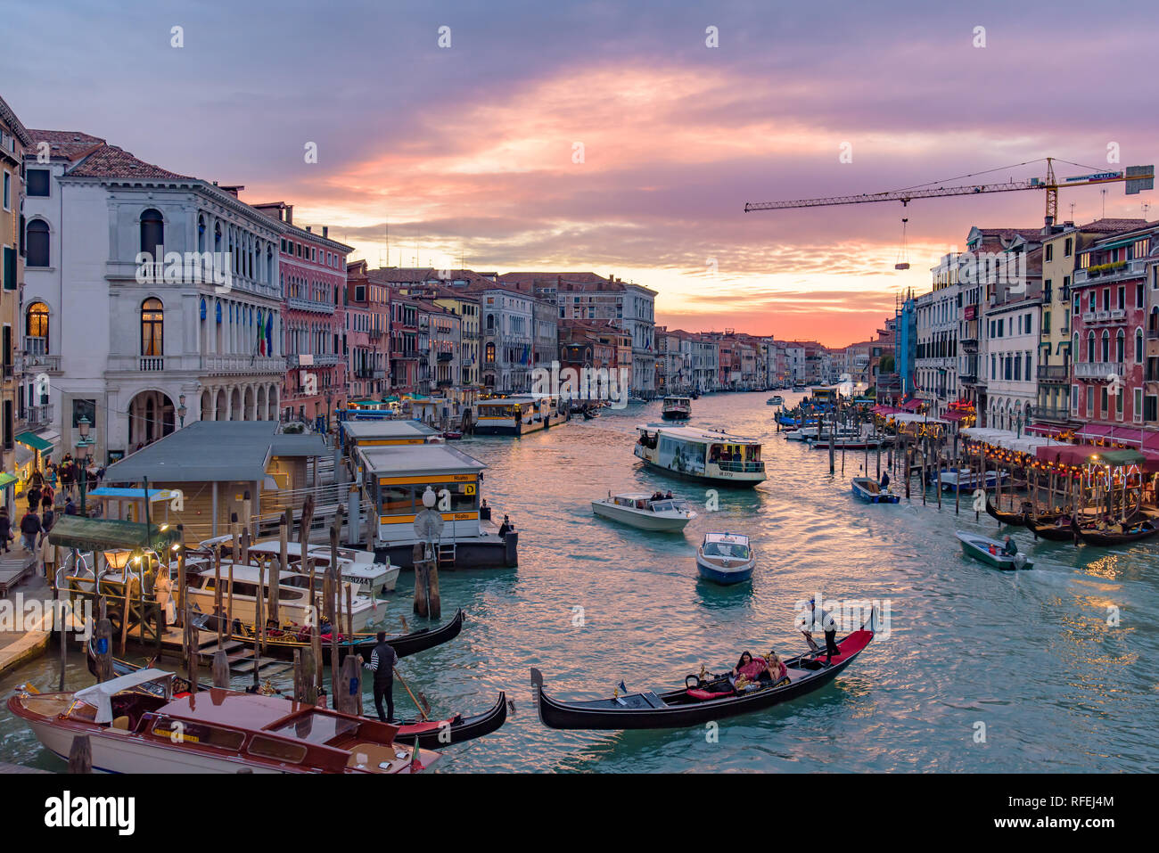 The Grand Canal with gondola and vaporetto at sunset time, Venice, Italy Stock Photo