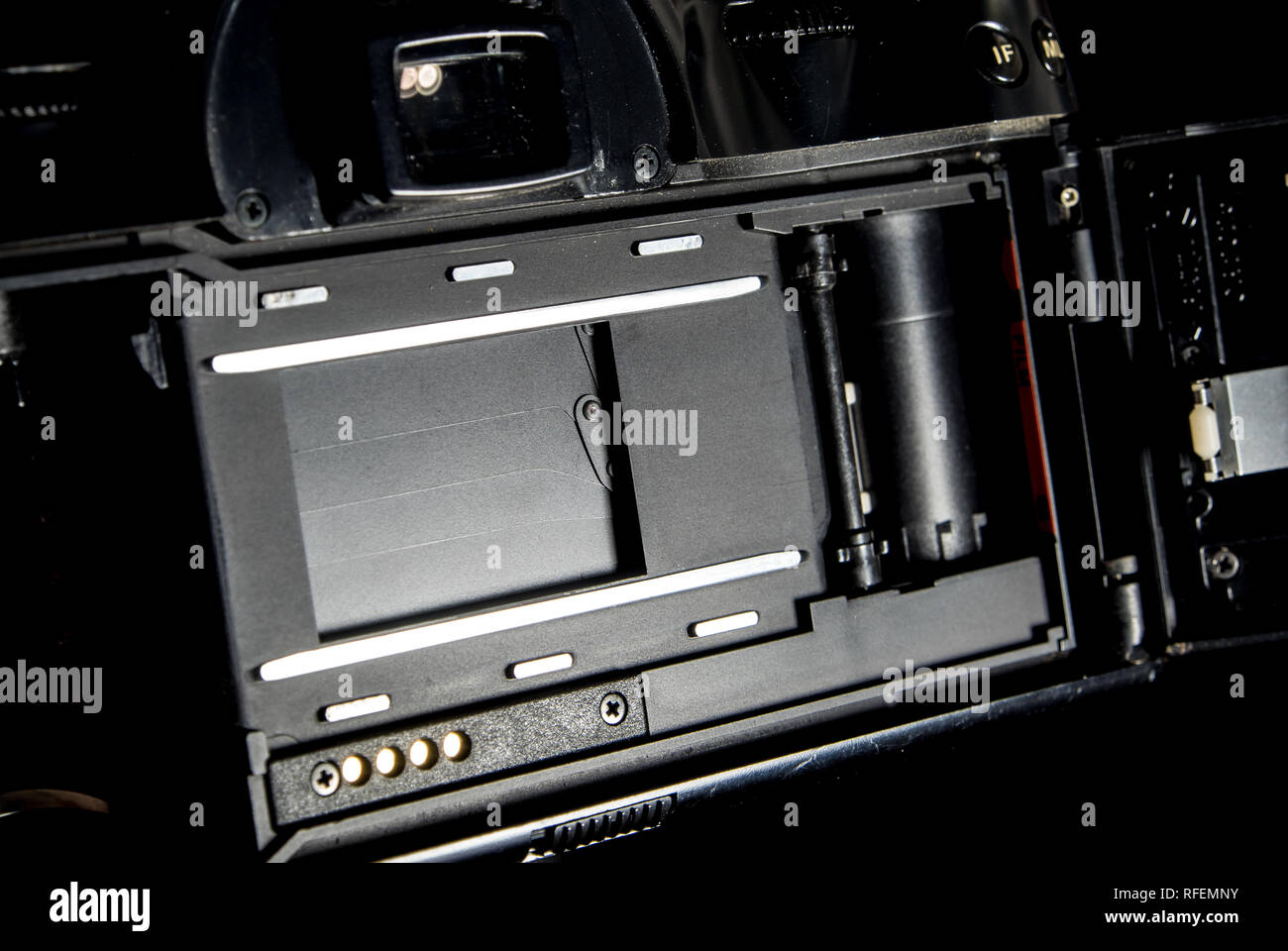 Back view of film system SLR camera body opened back lid to film