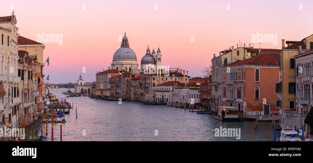Grand Canal with Santa Maria della Salute and gondola at sunset time, Venice, Italy Stock Photo