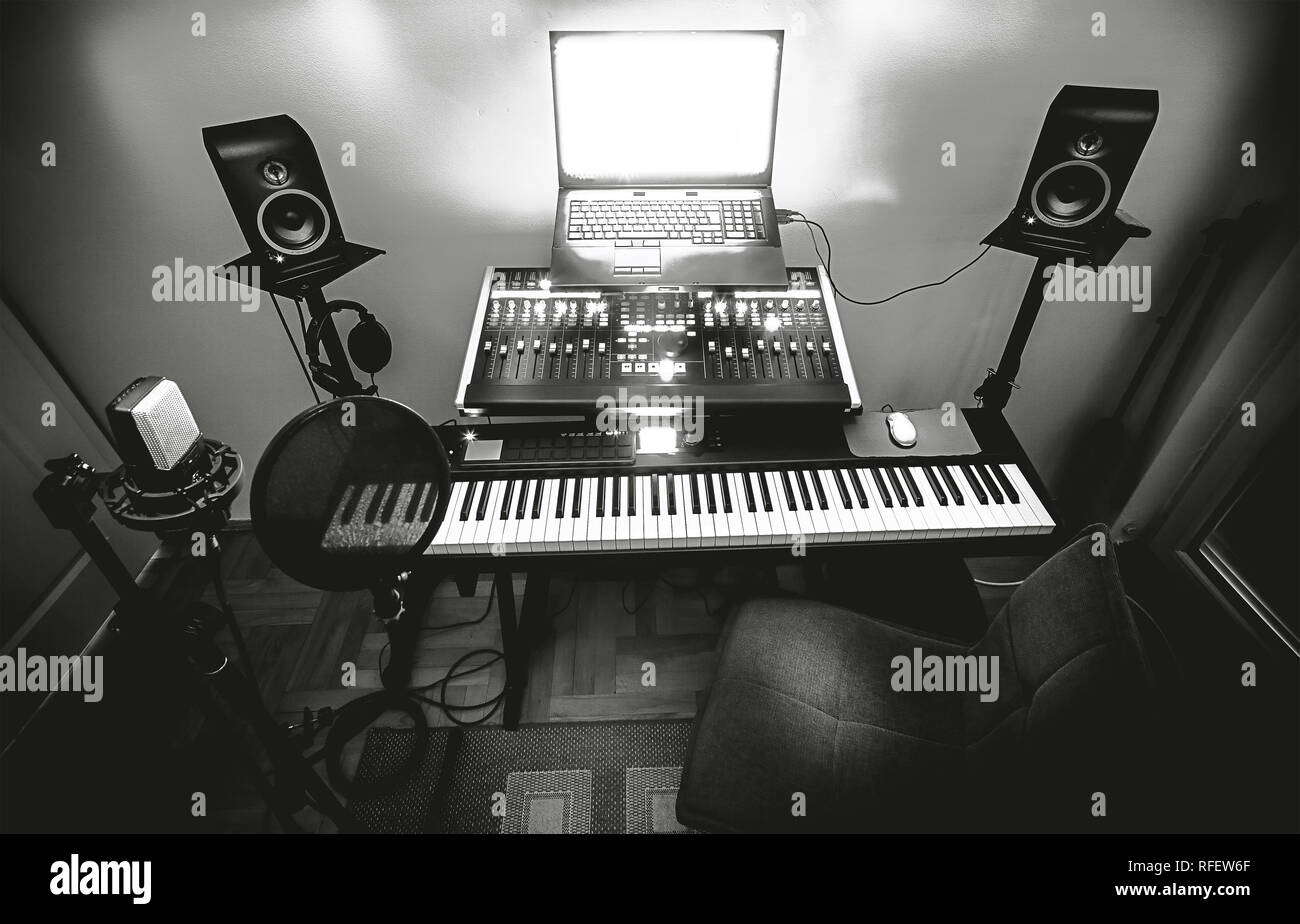 Interior of a small bedroom recording studio, details of equipment