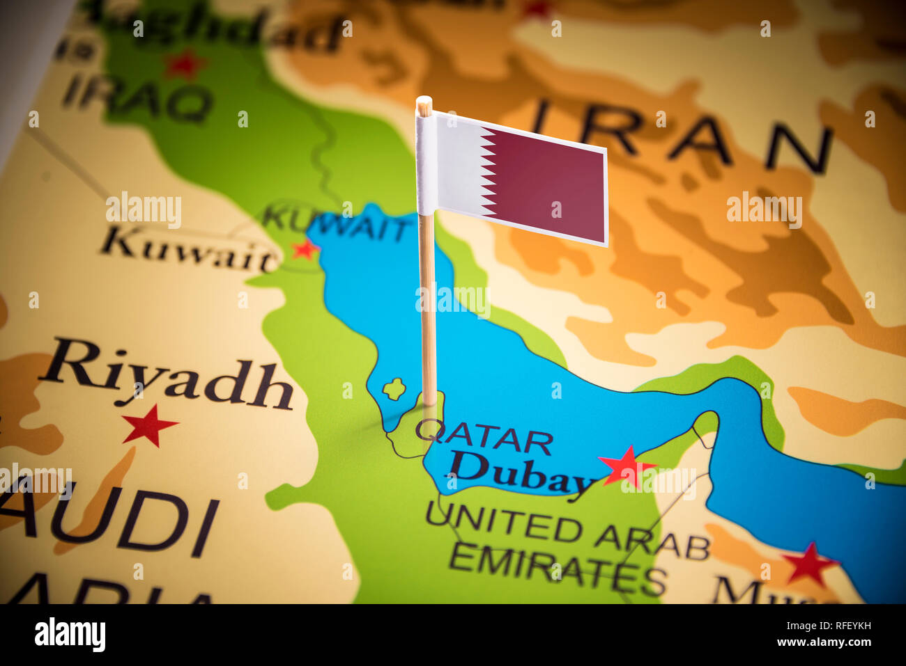 Qatar Definition Qatar marked with a flag on the map Stock Photo - Alamy