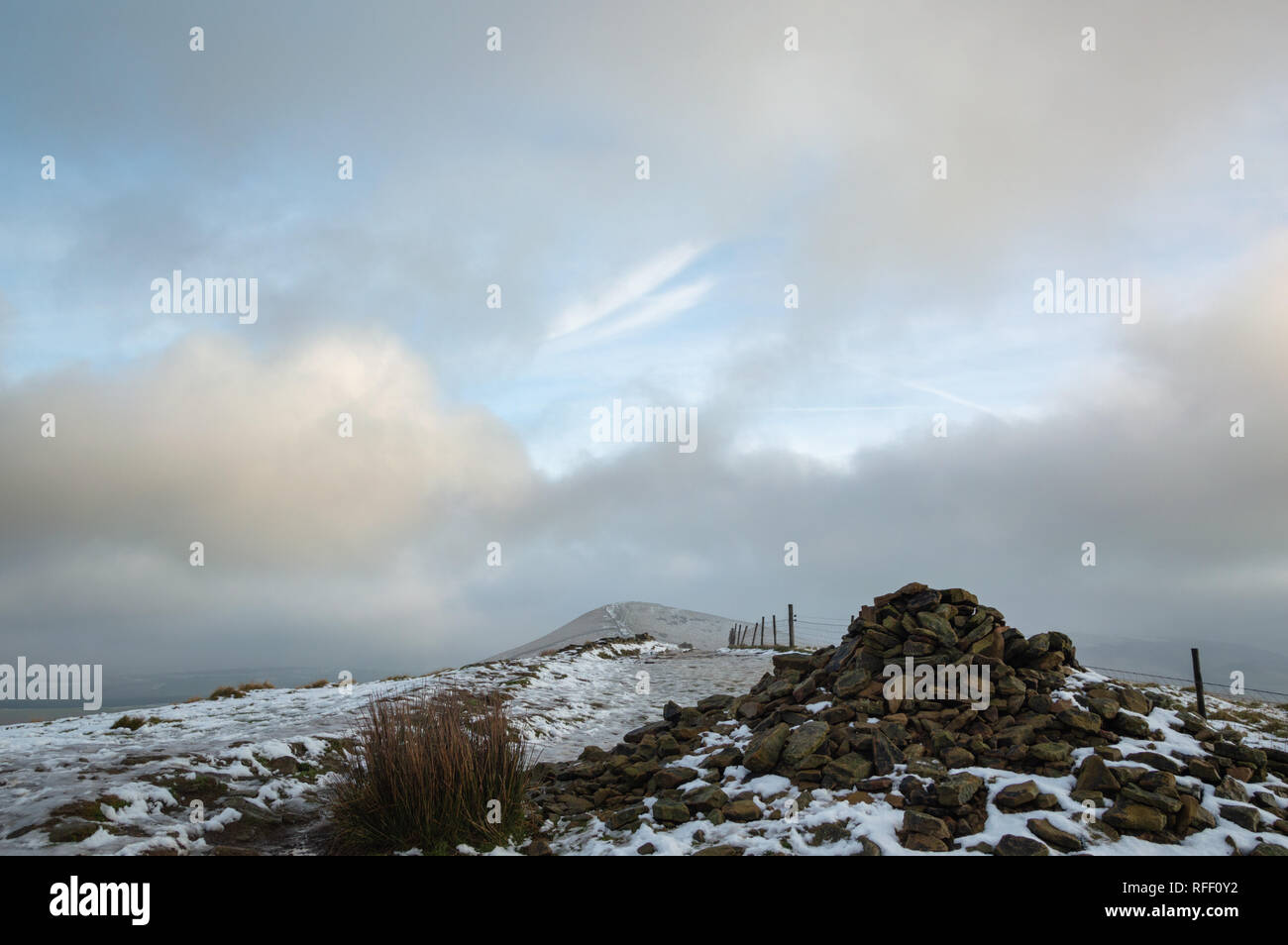 The path over Back Tor Cairn in the snow, Hope Valley, Peak District, Derbyshire, UK Stock Photo