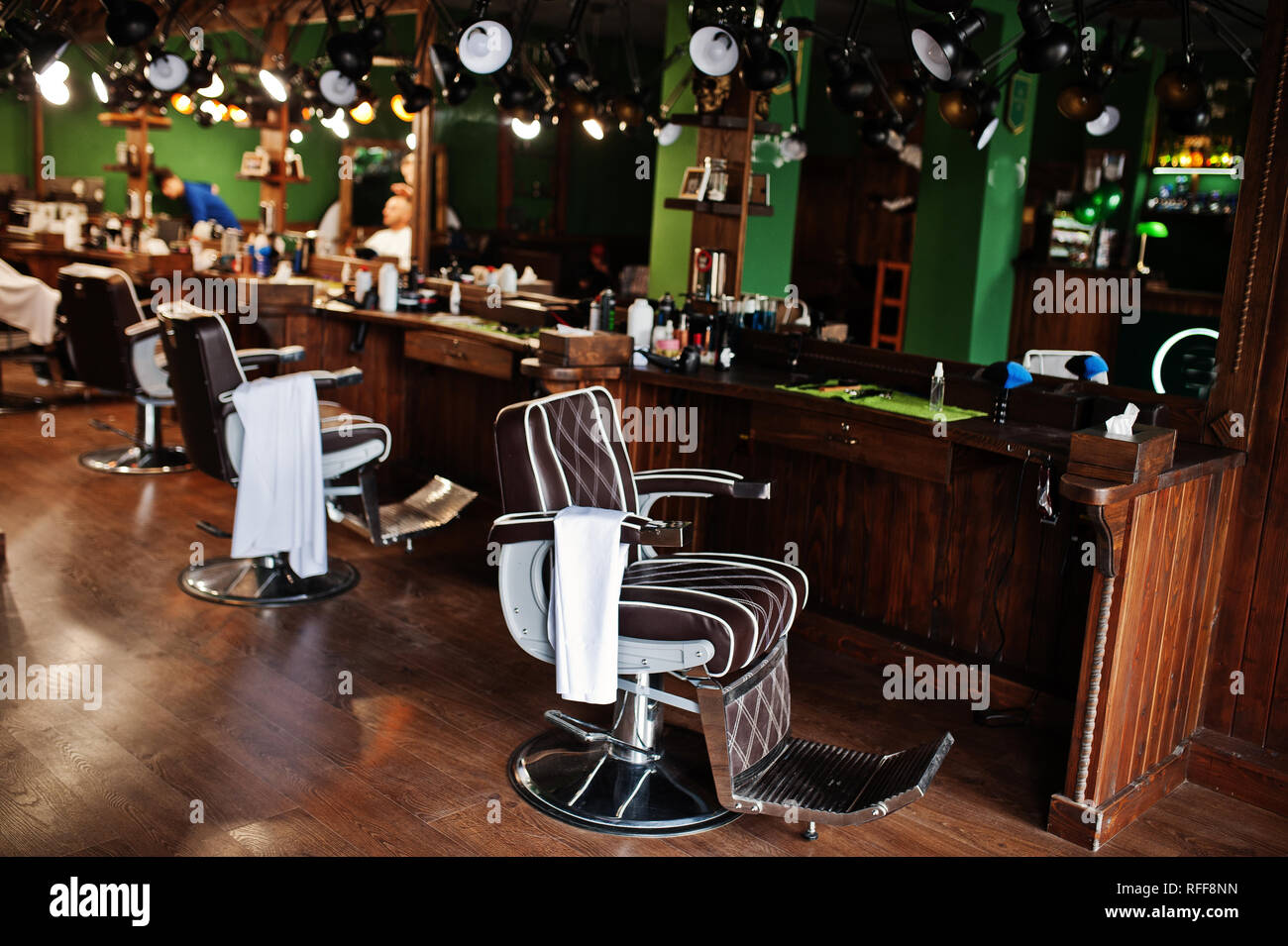 Brown vintage leather chairs at stylish barber shop Stock Photo Alamy