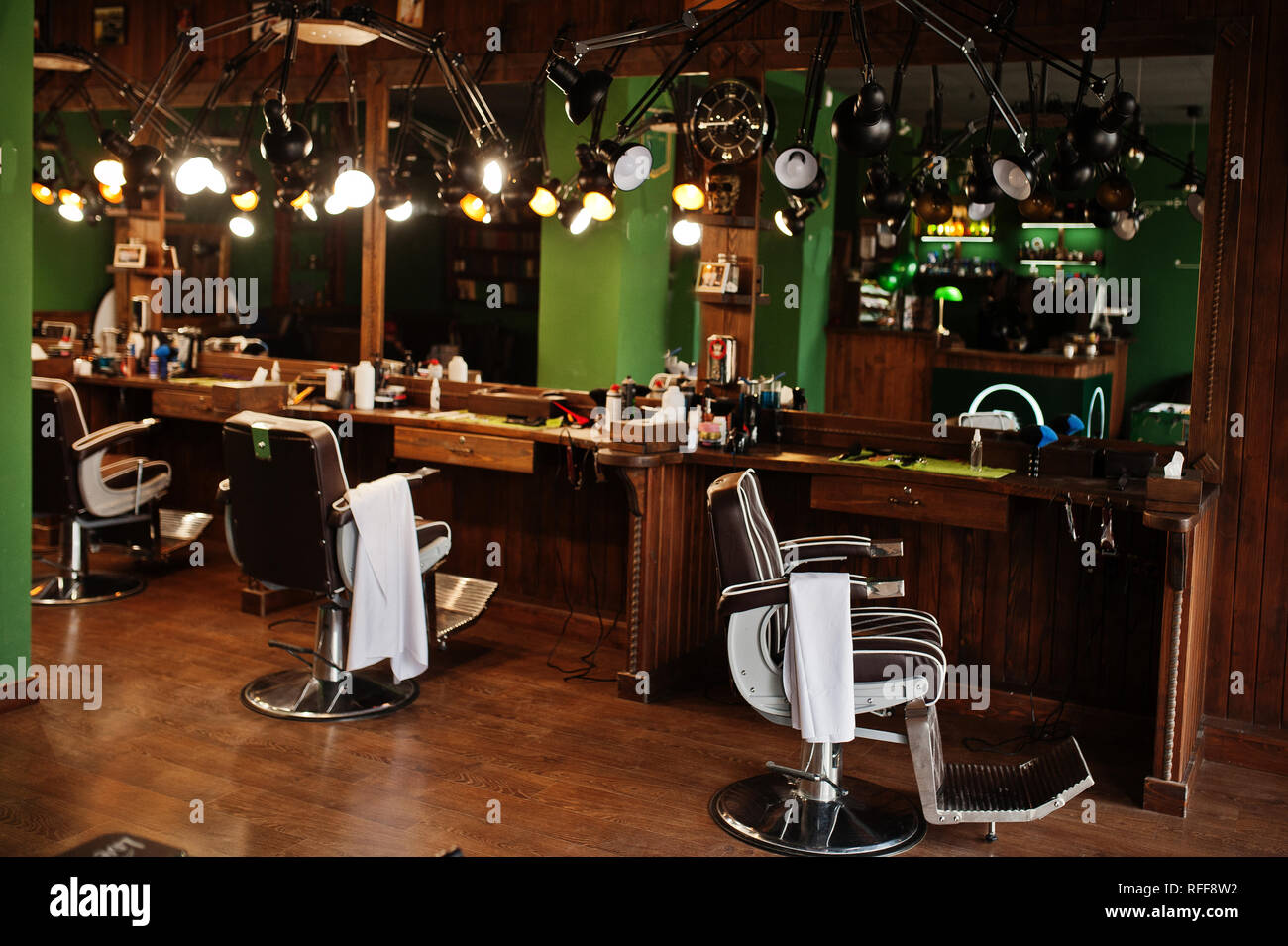 Brown vintage leather chairs at stylish barber shop Stock Photo Alamy