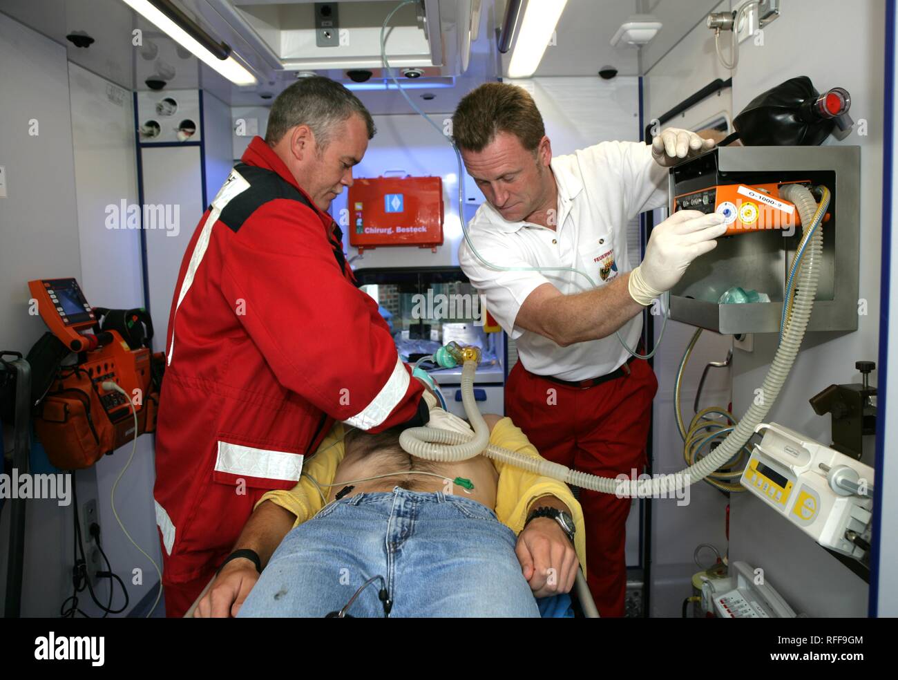 DEU Germany : Rescue paramedics in an ambulance truck attempt at resuscitation after a cardiac arrest. Training situation. | Stock Photo