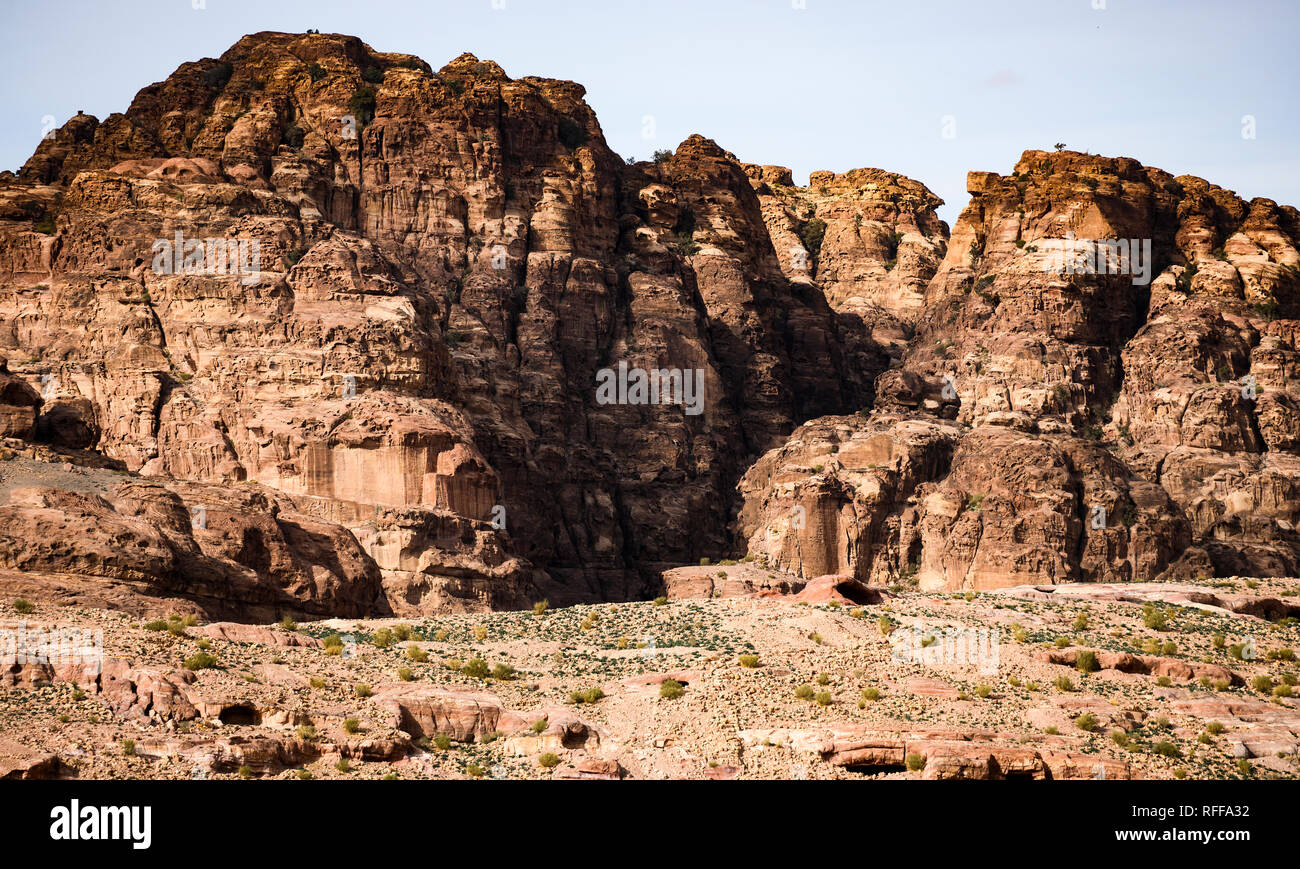 Amazing view of a beautiful canyon in Petra with rocky mountains in distance. Stock Photo