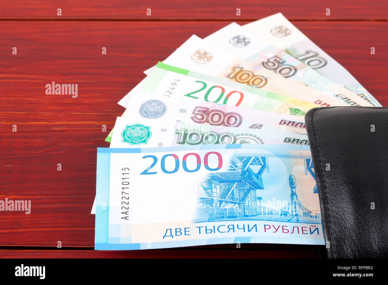 Russian money in the black wallet Stock Photo