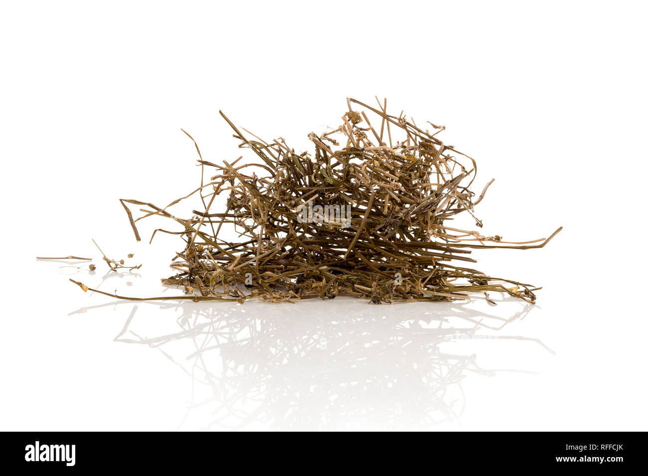 Dried Ma Huang in bowl isolated on white background. Clear heat, remove toxicity, excrete dampness and relieve stranguria. Stock Photo