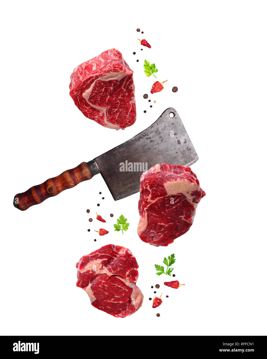 Raw marbled ribeye steak and butchers knife isolated Stock Photo