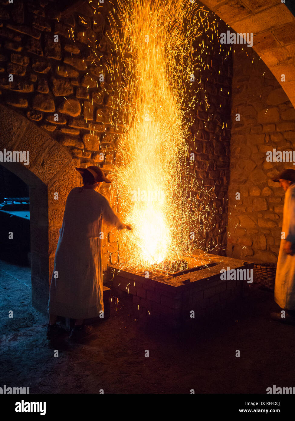 Blacksmith forging in the traditional way, as in the past, in the ...