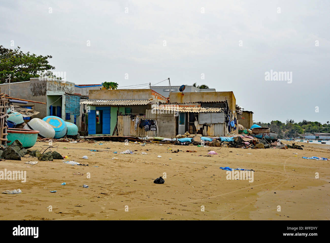 Mui Ne, Vietnam - December 27 2017. Houses at Mui Ne Fishing Village. Despite being a major tourist attraction in the area, it is littered with rubbis Stock Photo