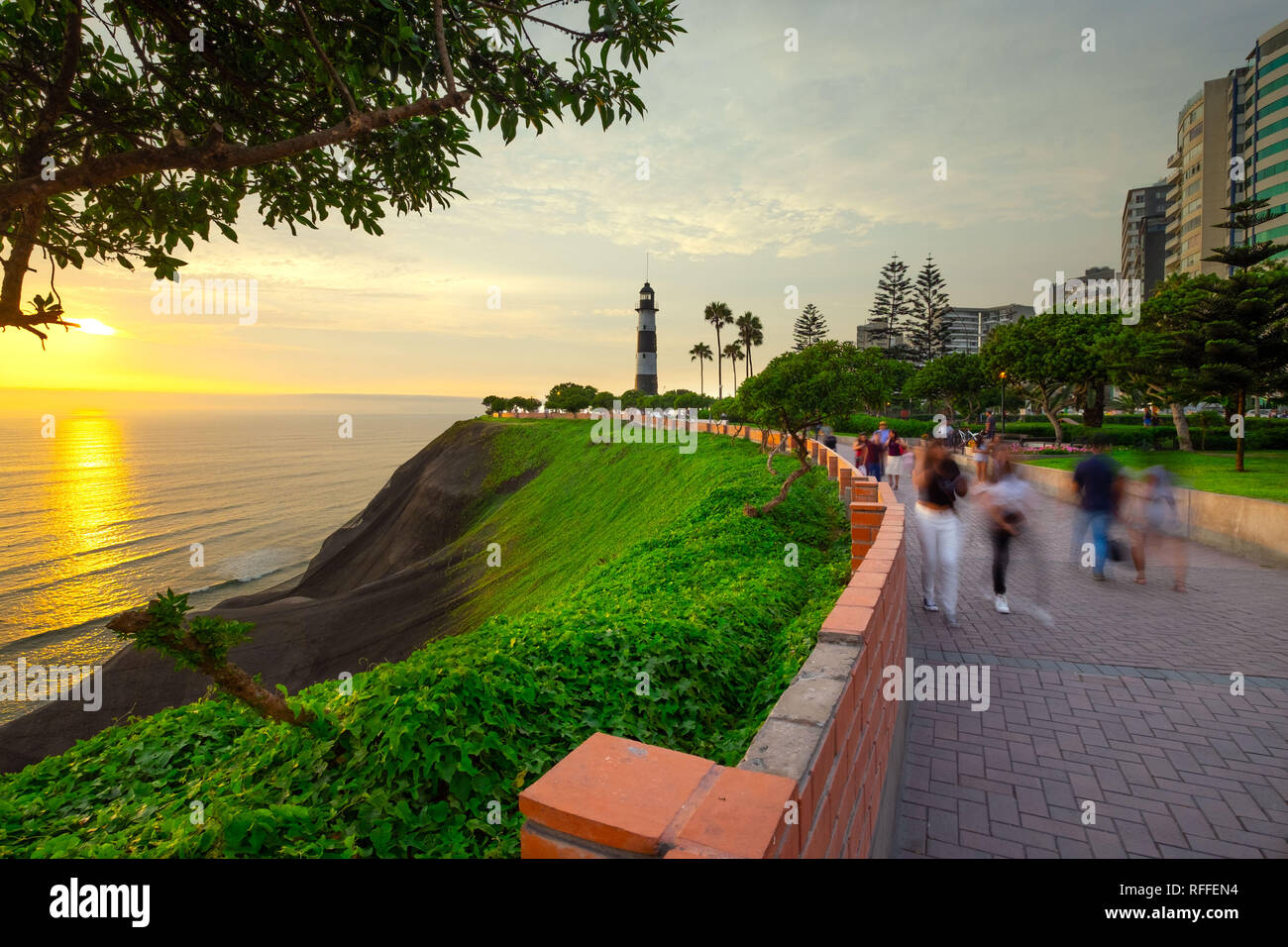 Long exposure of people walking on Costa verde - Lima - Peru with the sunset Stock Photo