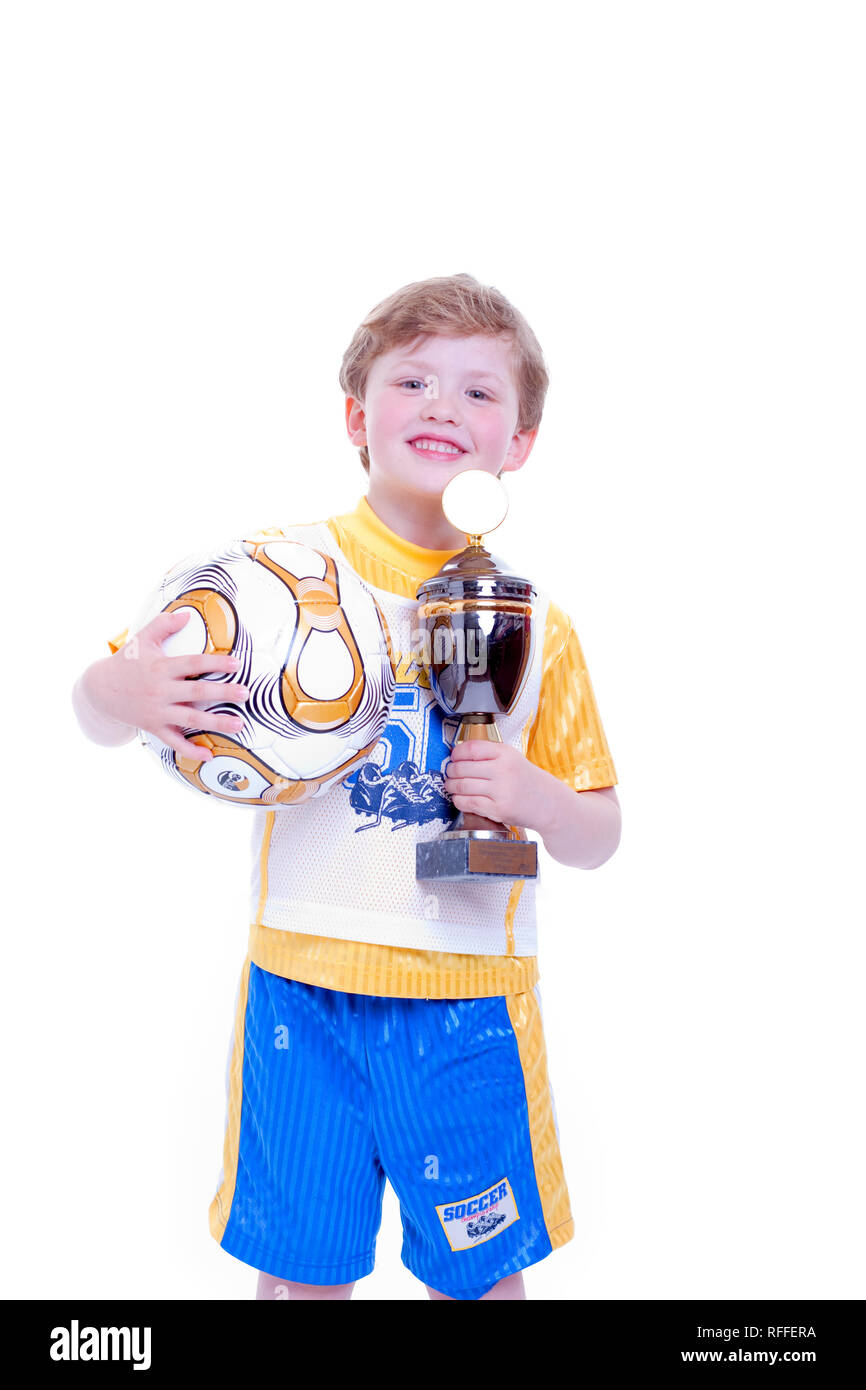 Small child with the football and the cup in the hand Stock Photo