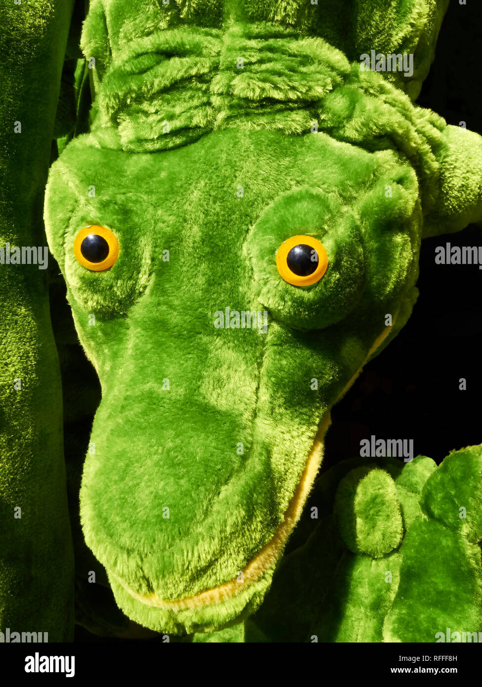 Close-up of a cute, soft green colored stuffed Crocodile toy seen in the Philippines Stock Photo