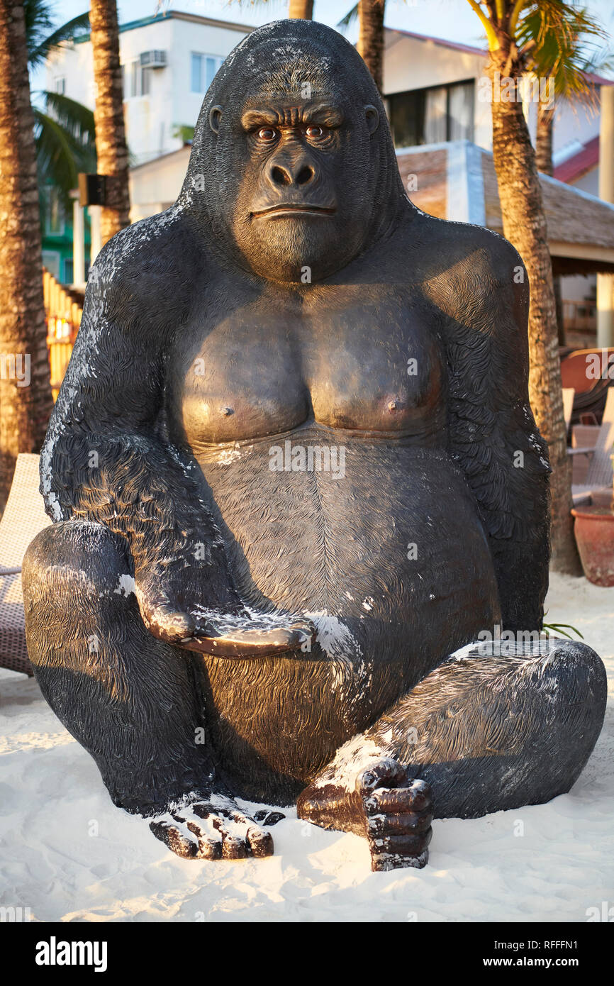 Giant Gorilla sculpture sitting in front of a beach resort along the White Beach of Boracay Island, Philippines Stock Photo