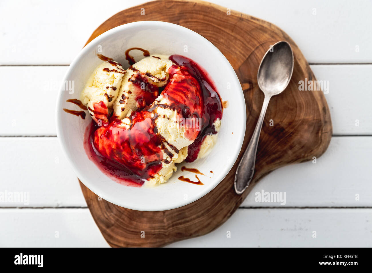 delicious vanilla ice cream with raspberry sauce and choco stripes ...