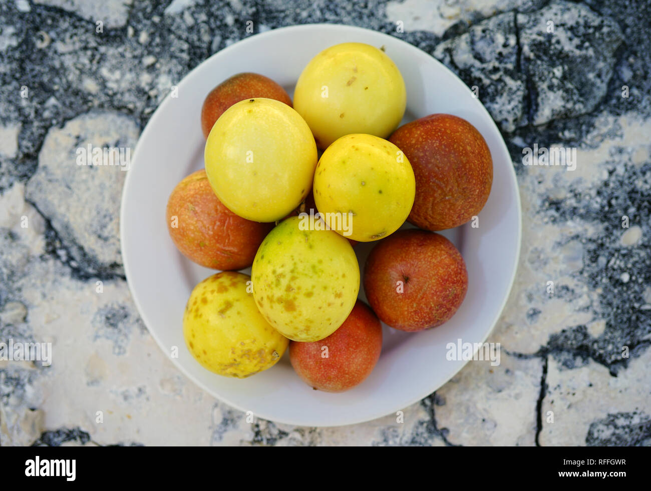 Platter of colorful ripe tropical passion fruit Stock Photo