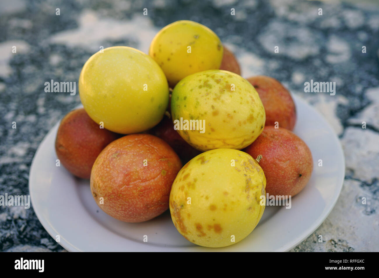 Platter of colorful ripe tropical passion fruit Stock Photo