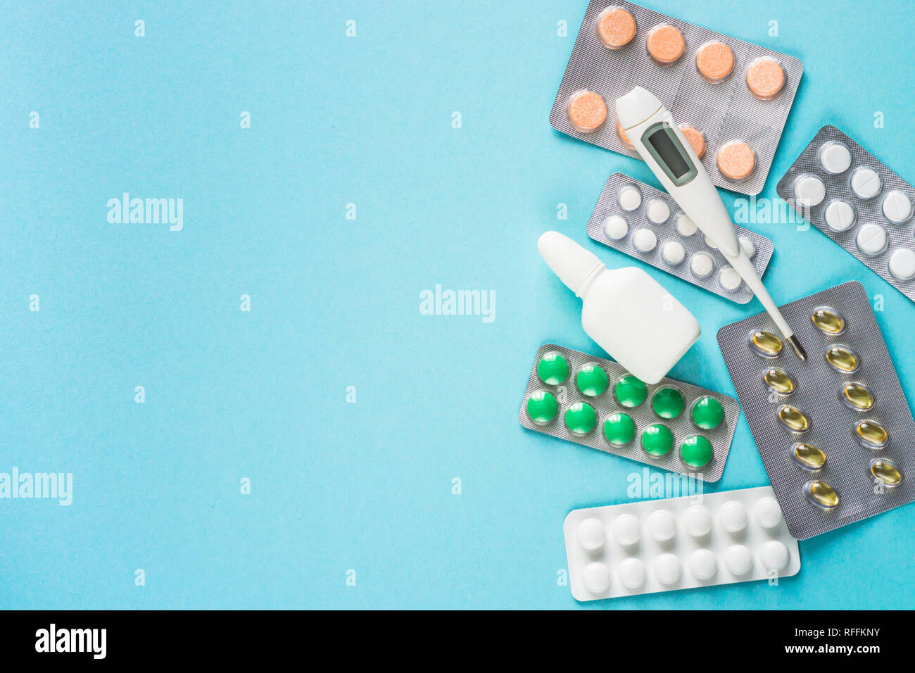 Pills on blue background. Medicine  pharmacy concept. Stock Photo