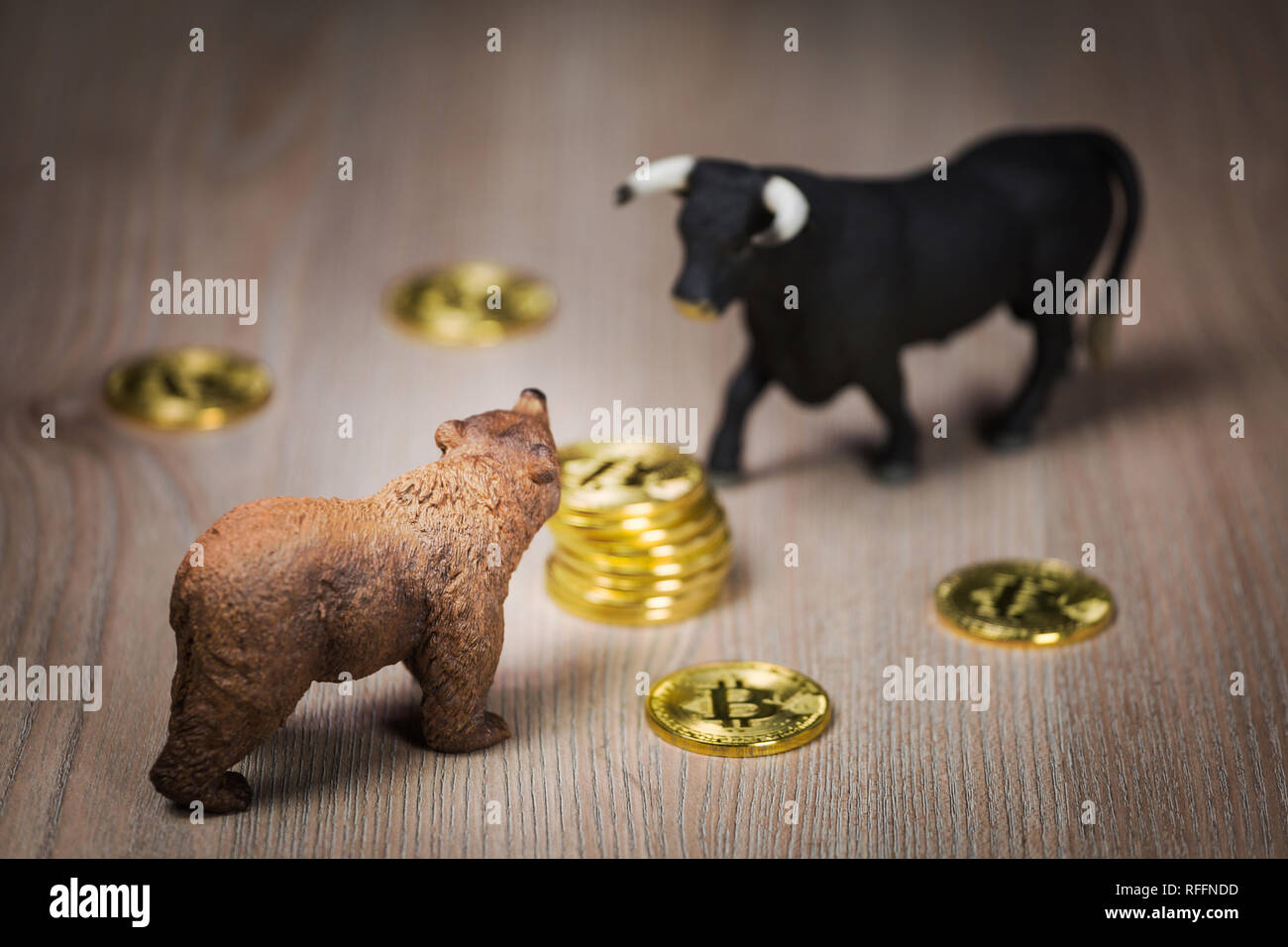 Cryptocurrency bitcoin bear and bull figures on a wooden table. Bearish or bullish  market trend concept Stock Photo - Alamy