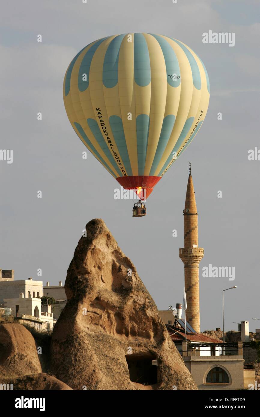 TUR Turkey Cappadocia Hot Air Ballooning over Cappadocia. Balloons of 'Kapadokya Balloons'. Over the village of Uchisar Stock Photo