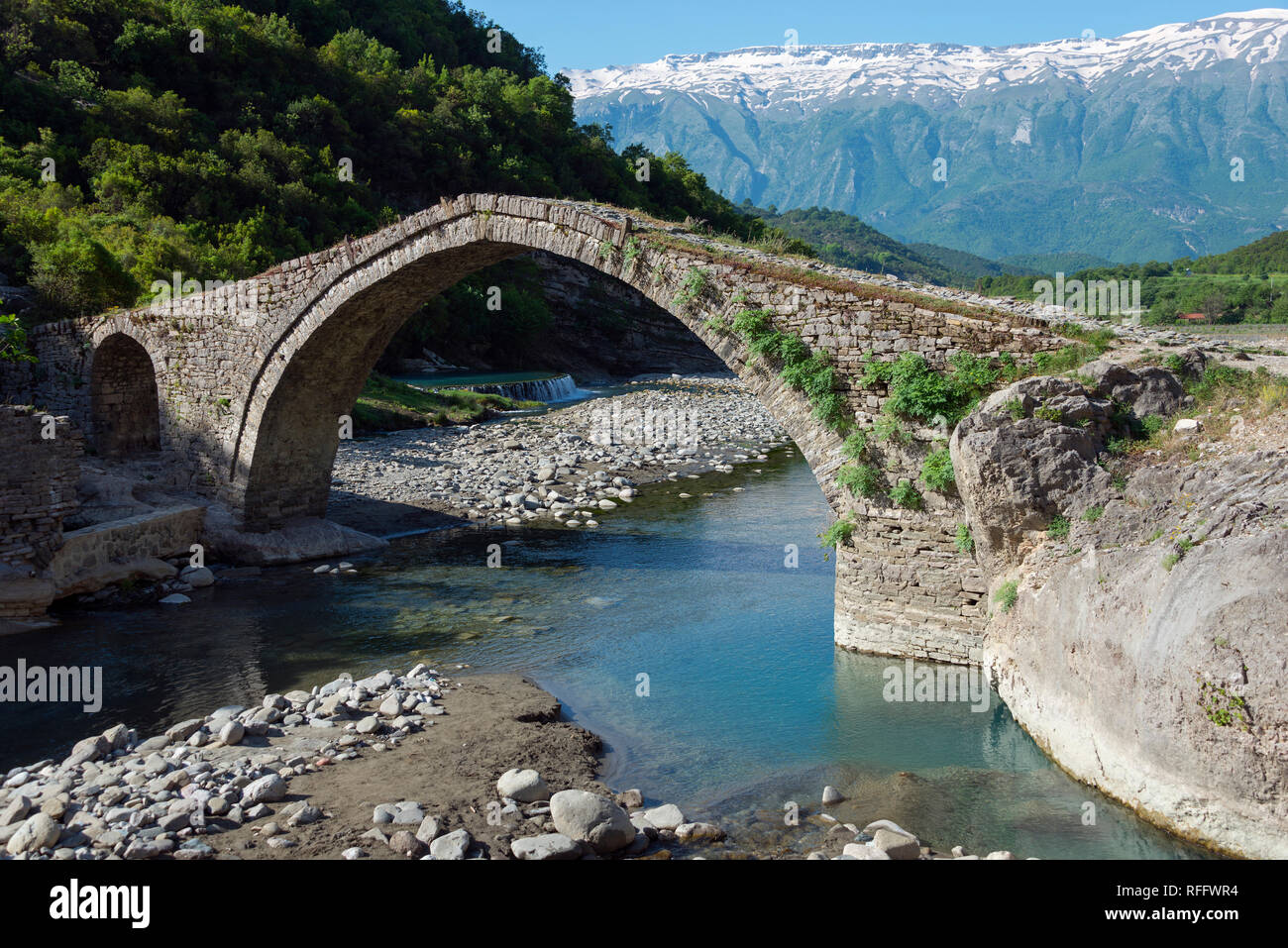 Ottoman stone arch bridge Ura e Katiut, river Lengarica, Benja, Albania, Benje Stock Photo