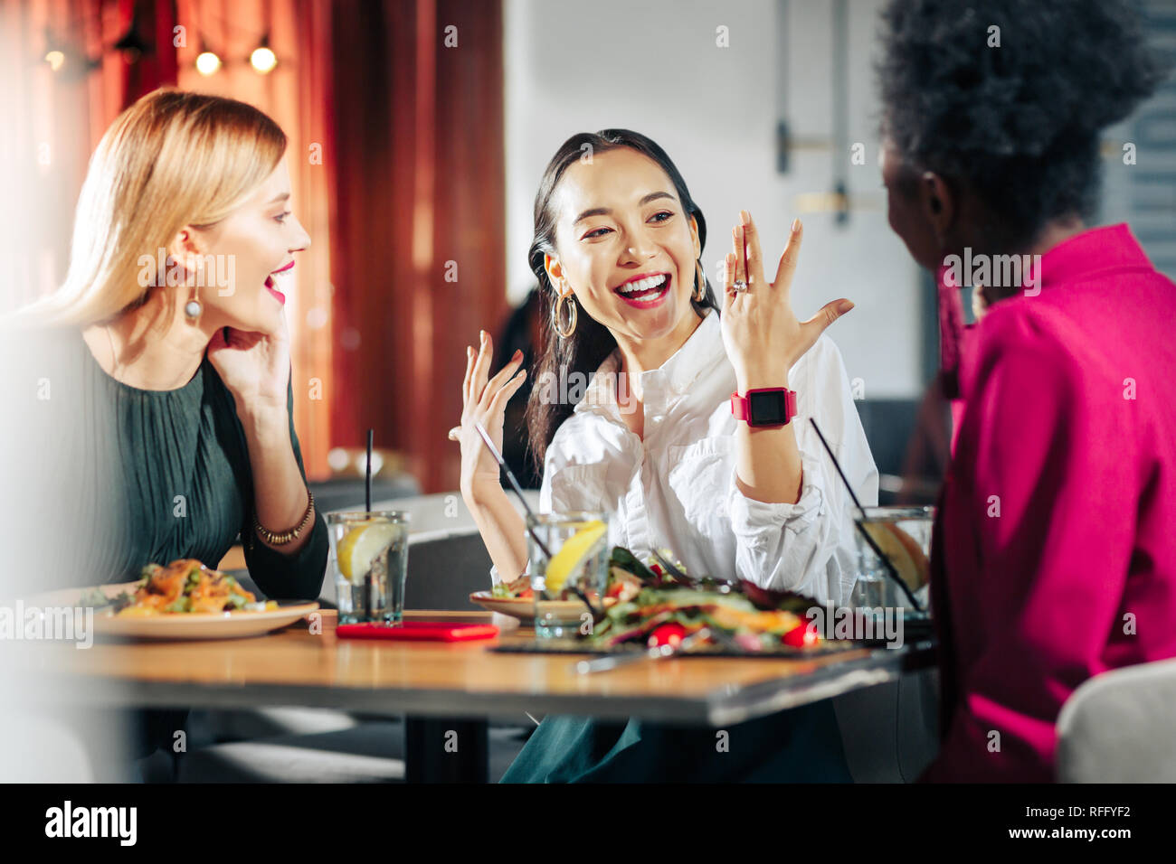 Beautiful woman feeling extremely happy after engagement Stock Photo