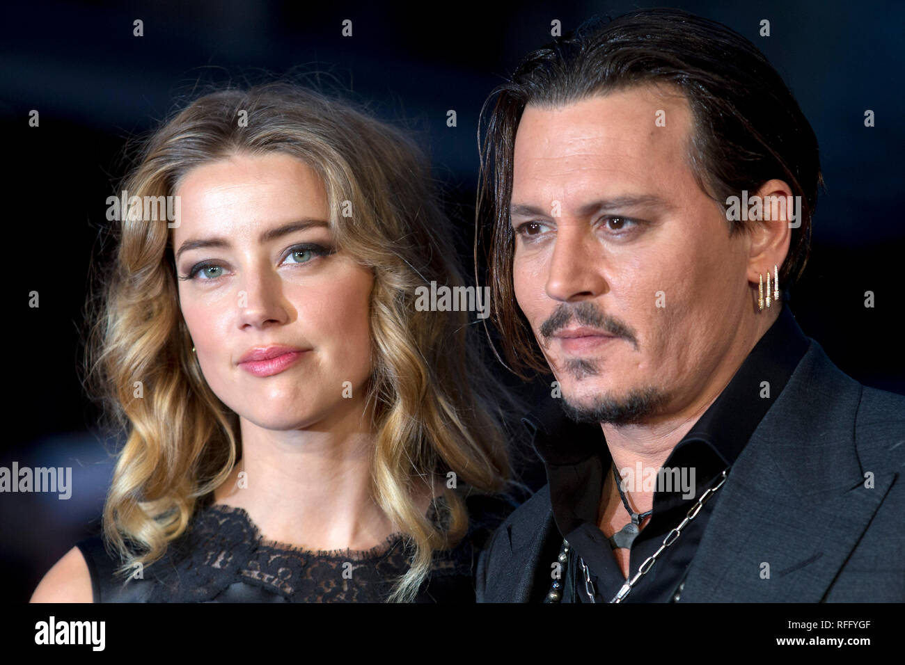 Johnny Depp & Amber Heard pose at premiere in London. October, 2015. Stock Photo